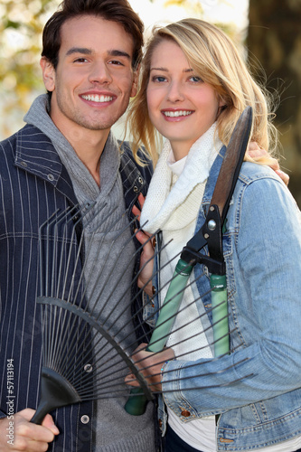 Photo: Young couple gardening Young couple gardening