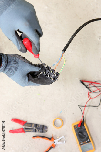 Photo: Electrician wiring a house Electrician wiring a house