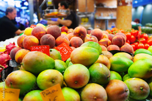 Photo: Mangoes and other fruits on counter Mangoes and other fruits on counter