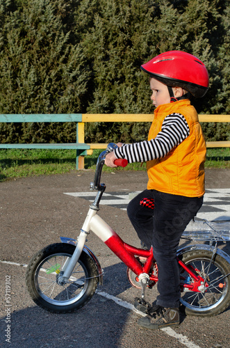 Photo: Small boy riding his bicycle Small boy riding his bicycle