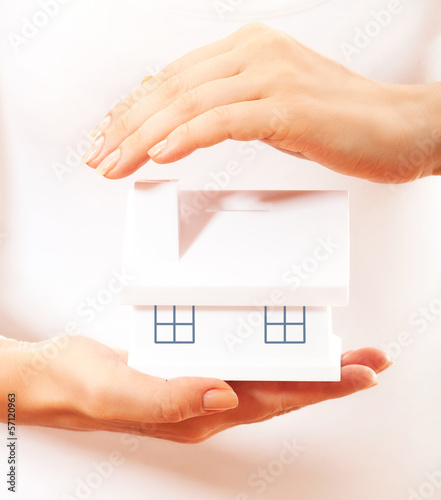 Photo: The house in human hands The house in human hands