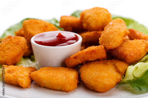 Photo: Chicken nuggets on white background Chicken nuggets on white background