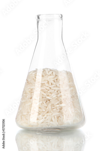 Photo: Groats in test tube isolated on white Groats in test tube isolated on white