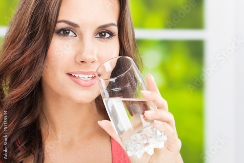 Photo: Young woman drinking water, outdoor Young woman drinking water, outdoor