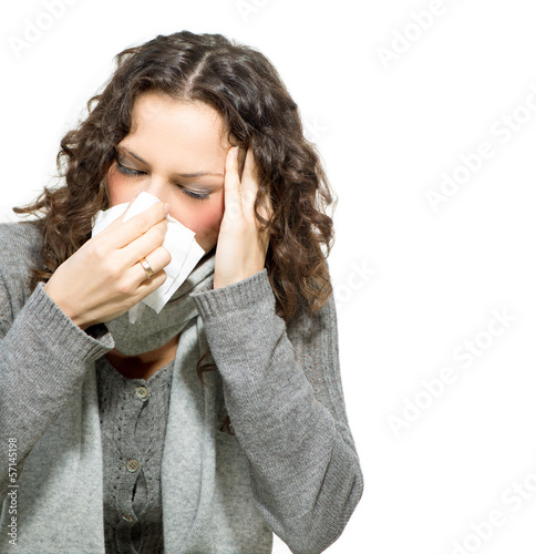 Photo: Sick Woman. Flu. Woman Caught Cold. Sneezing into Tissue Sick Woman. Flu. Woman Caught Cold. Sneezing into Tissue