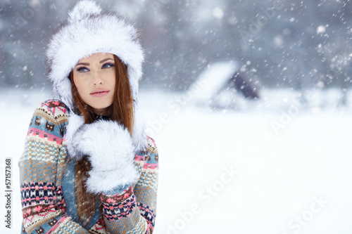 Photo: Attractive young woman in wintertime outdoor Attractive young woman in wintertime outdoor