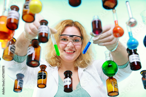 Photo: chemist woman with chemical glassware tubes chemist woman with chemical glassware tubes