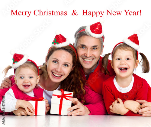 Photo: Happy family celebrating Christmas Happy family celebrating Christmas