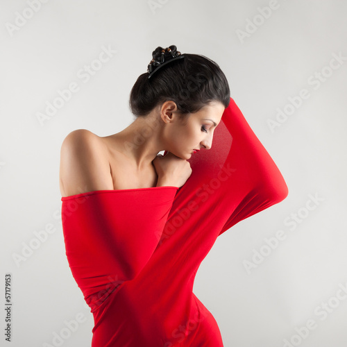 Photo: Portrait of beautiful brunette woman with red elastic cloth. Portrait of beautiful brunette woman with red elastic cloth.