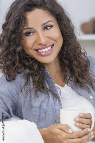 Photo: Beautiful Woman Smiling Drinking Tea or Coffee Beautiful Woman Smiling Drinking Tea or Coffee