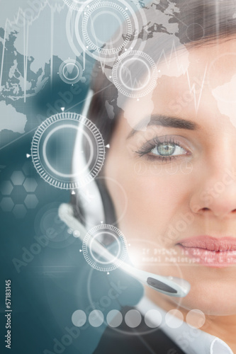 Photo: Attractive businesswoman using futuristic interface hologram Attractive businesswoman using futuristic interface hologram