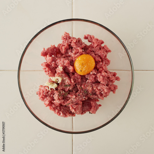 Photo: Ingredients for making meatballs on a bowl Ingredients for making meatballs on a bowl