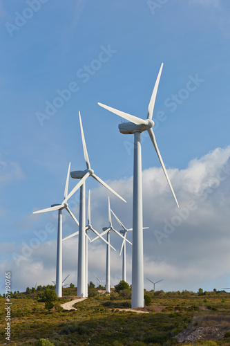 Photo: Group of windmills for renewable electric energy production Group of windmills for renewable electric energy production