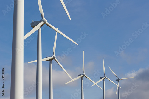 Photo: Group of windmills for renewable electric energy production Group of windmills for renewable electric energy production