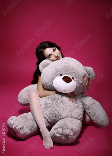Photo: Dreaminess. Sentimental Girl with Soft Toy Gray Bruin in Embrace Dreaminess. Sentimental Girl with Soft Toy Gray Bruin in Embrace