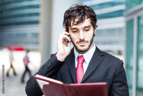 Photo: Businessman talking on the phone Businessman talking on the phone