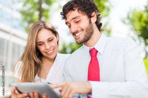 Photo: Couple using a digital tablet Couple using a digital tablet