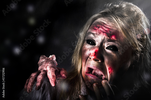 Photo: Halloween horror. Zombie in fear from evil thing Halloween horror. Zombie in fear from evil thing