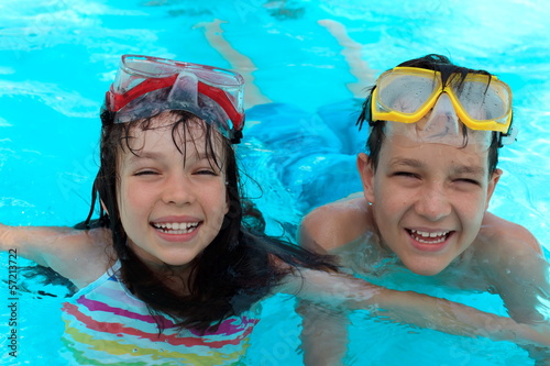 Photo: Happy kids swimming Happy kids swimming