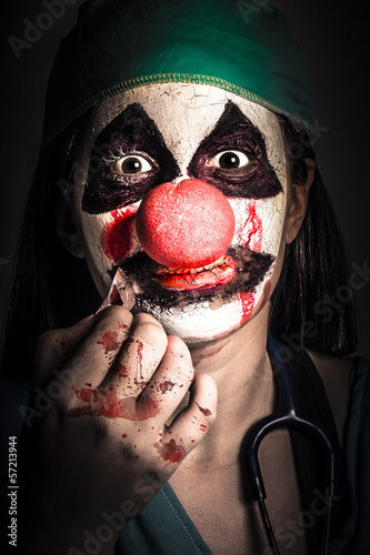 Photo: Horror clown girl in silence with stitched lips Horror clown girl in silence with stitched lips