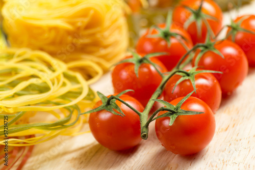 Photo: close-up of cherry tomatoes and pasta close-up of cherry tomatoes and pasta