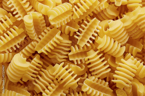 Photo: Raw radiatori pasta texture Raw radiatori pasta texture