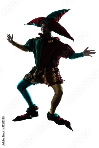 Photo: man in jester costume silhouette jumping man in jester costume silhouette jumping