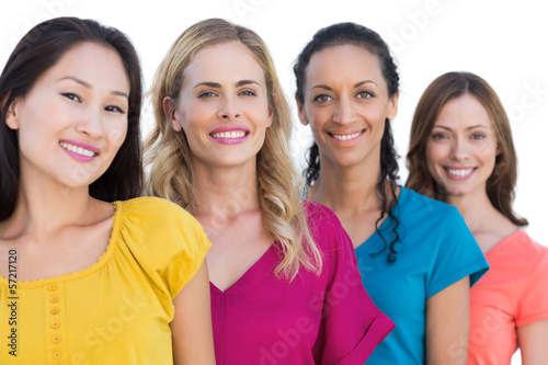 Photo: Cheerful models posing and looking at camera Cheerful models posing and looking at camera