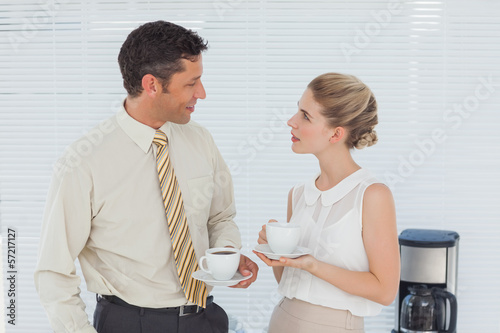 Photo: Stylish workmates having coffee together Stylish workmates having coffee together