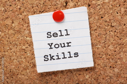 Photo: Sell Your Skills paper note on a cork notice board Sell Your Skills paper note on a cork notice board