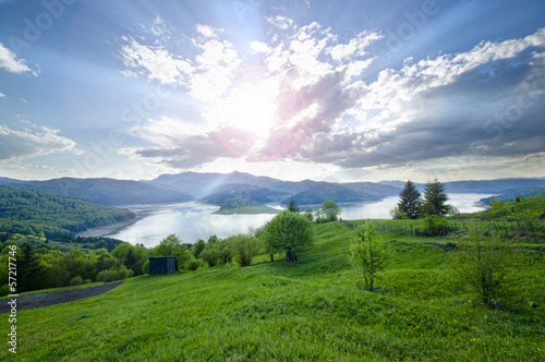 Photo: Rural scene of mountain and lake at summer Rural scene of mountain and lake at summer