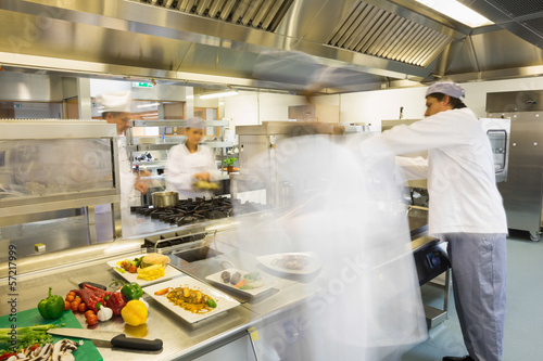 Photo: Chefs busy at work Chefs busy at work