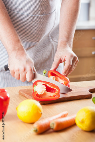Photo: man cutting paprika man cutting paprika