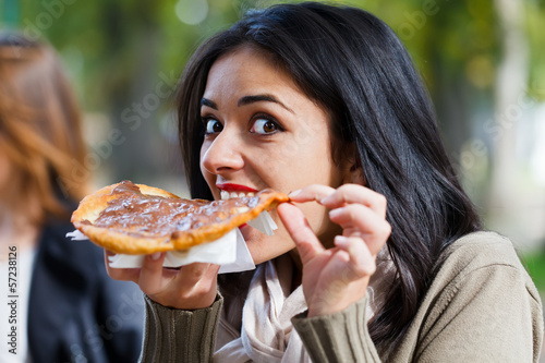 Photo: Girl Nibbling Chocolate Scone Girl Nibbling Chocolate Scone