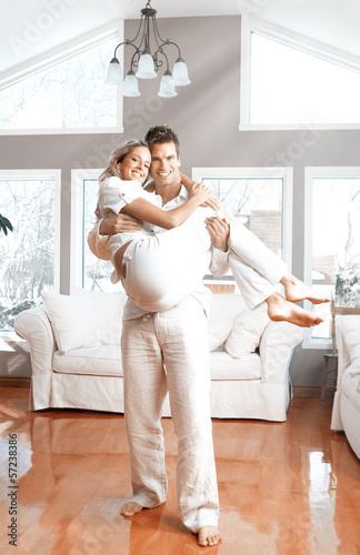 Photo: Happy couple at home. Happy couple at home.