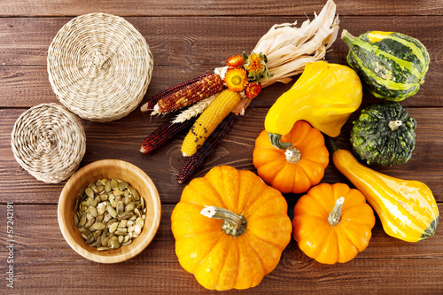 Photo: Fresh pumpkins on a wooden table Fresh pumpkins on a wooden table