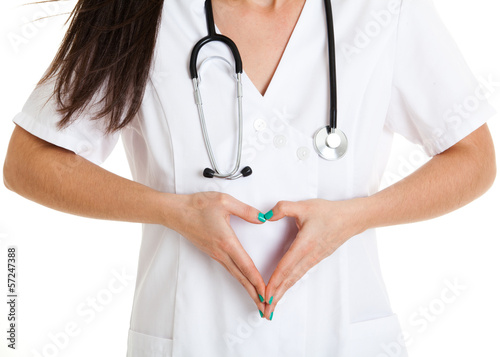 Photo: Doctor's hands making heart shape isolated on white background. Doctor's hands making heart shape isolated on white background.