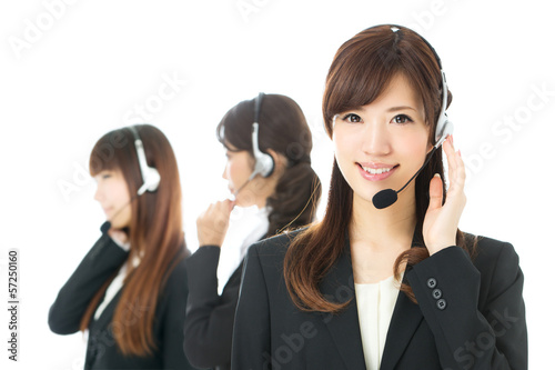 Photo: Beautiful asian business operator isolated on white background Beautiful asian business operator isolated on white background