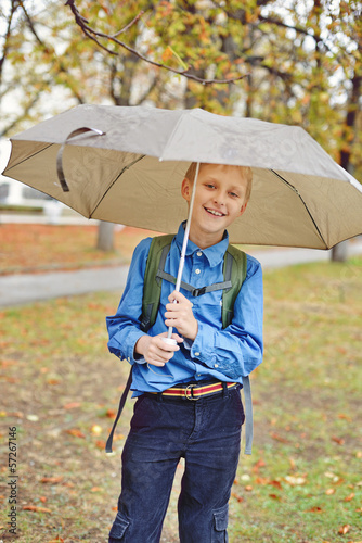 Photo: schoolboy with umbrella schoolboy with umbrella