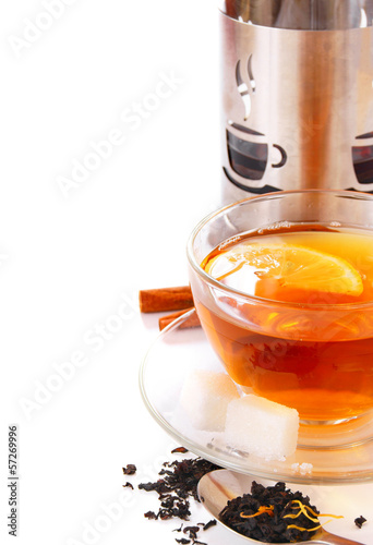 Photo: Tea with a lemon. On a white background. Tea with a lemon. On a white background.