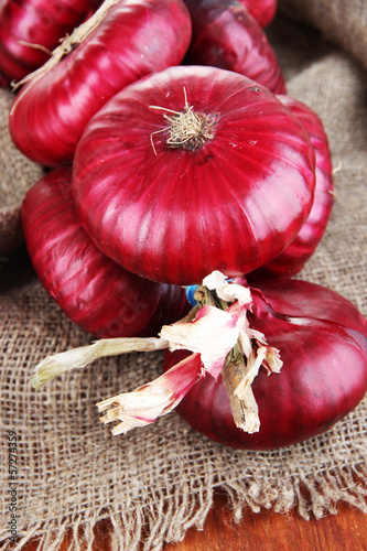 Photo: Fresh red onions on burlap Fresh red onions on burlap