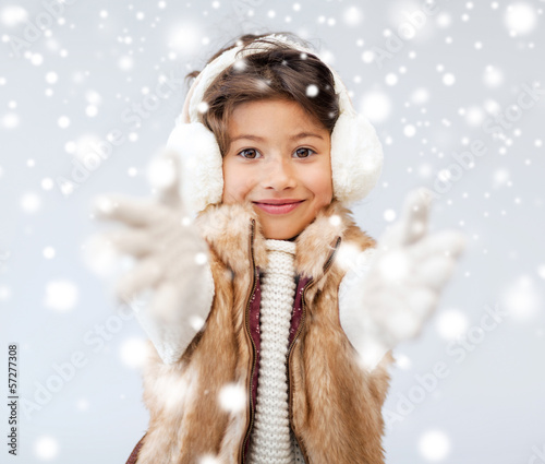 Photo: happy littl girl in winter clothes happy littl girl in winter clothes