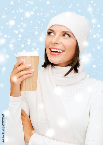 Photo: woman in hat with takeaway tea or coffee cup woman in hat with takeaway tea or coffee cup