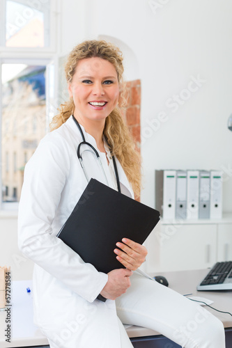 Photo: doctor with test result in document or dossier doctor with test result in document or dossier