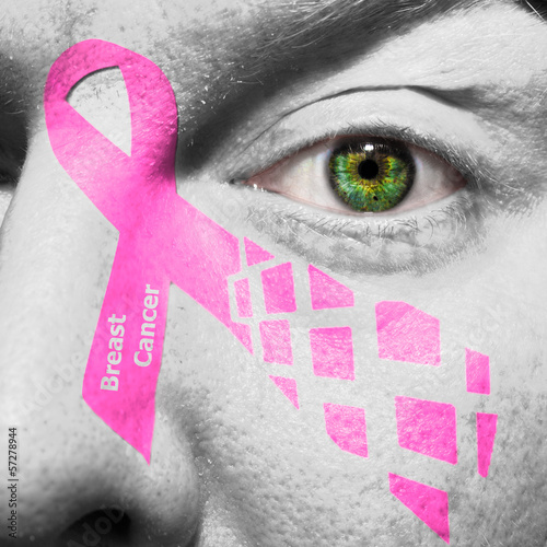 Photo: Pink breast cancer ribbon on a face Pink breast cancer ribbon on a face