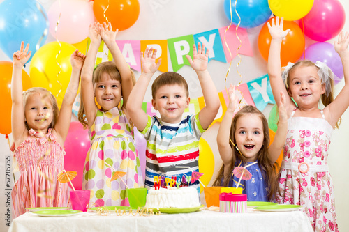 Photo: happy kids celebrating birthday holiday happy kids celebrating birthday holiday