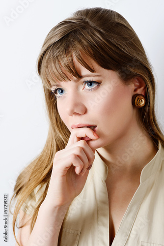 Photo: thoughtful young woman thoughtful young woman