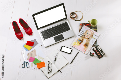 Photo: Overhead of a essentials objects in a fashion blogger Overhead of a essentials objects in a fashion blogger
