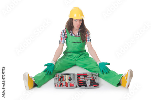 Photo: Young woman with toolkit on white Young woman with toolkit on white