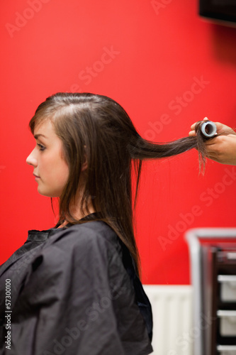 Photo: Portrait of hands rolling hair Portrait of hands rolling hair